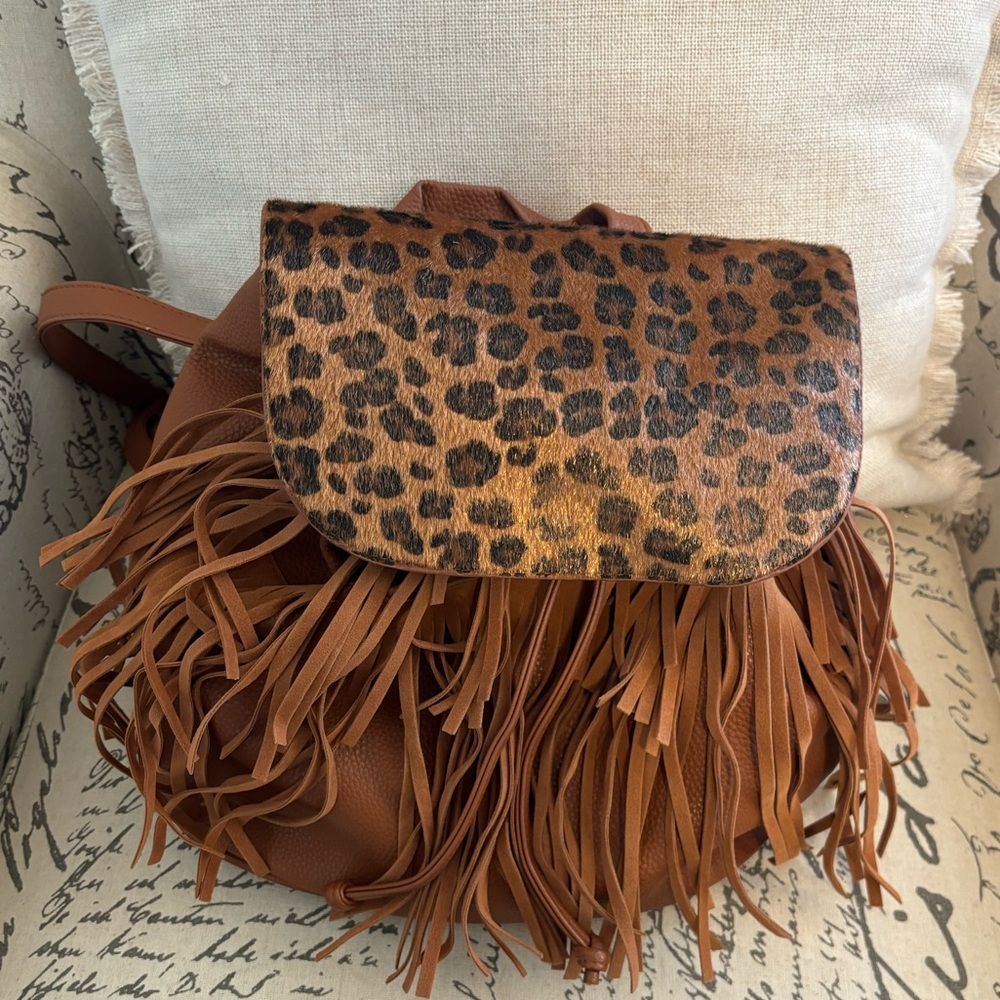 Venus brand pleather backpack, fringe detailing on front, cheetah print on top